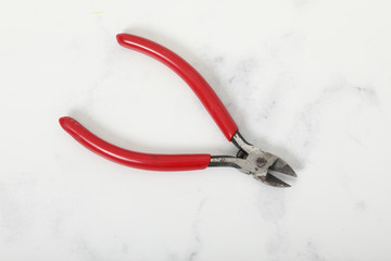 red Nippers. On a white background. steel tool