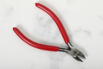 red Nippers. On a white background. steel tool