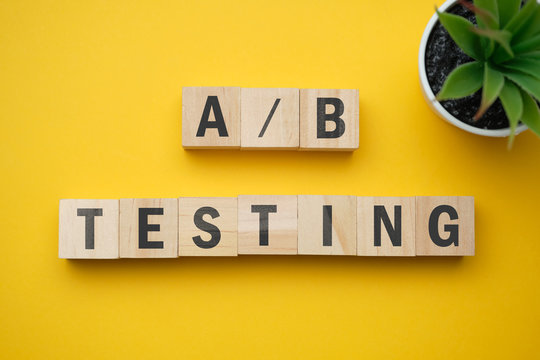 Modern marketing buzzword - A and B testing. Top view on wooden table with blocks. Top view.