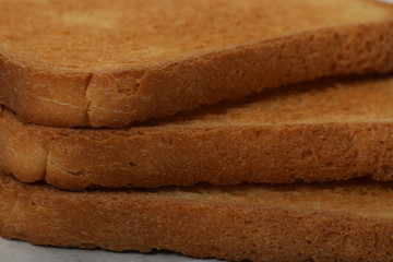 Toast biscuits over white background crunchy food