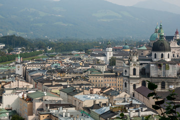 Fototapeta na wymiar Salzburg top view from above on Salzach river aerial panoramic at a historic city center with cathedrals in Austria, Europe 