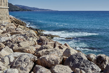 Fototapeta na wymiar Huge large gray stones on the beach. The coast-line.