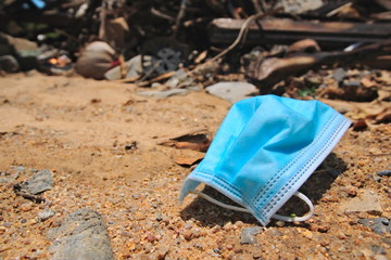Medical mask in the garbage dump