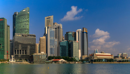Fototapeta na wymiar Skyscapers of the Singapore city business district skyline at Marina Bay of downtown in daytime