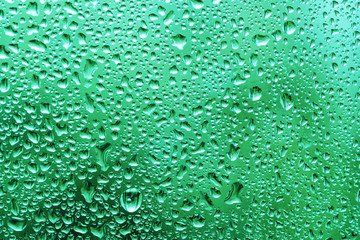Water drops on the window glass after summer rain background