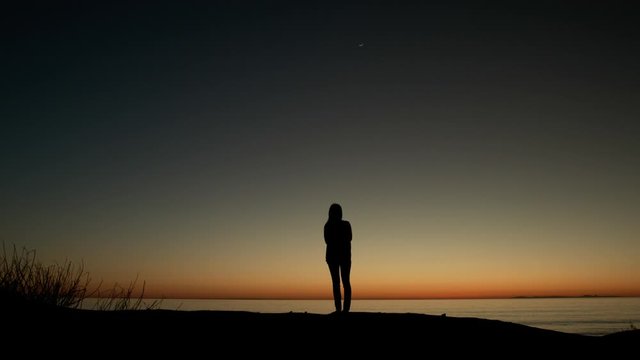 silhouette of a girl at the sunset