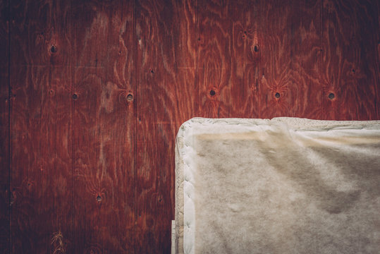 Close-up Of White Cover Against Wooden Floor