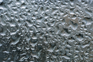 Water drops on the glass surface background