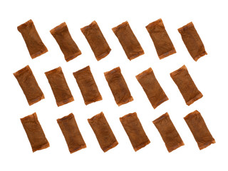 Pattern of smokeless tobacco pouches isolated on white