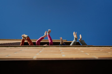 family of children and mother claps her hands to thank the health system in Spain during the...