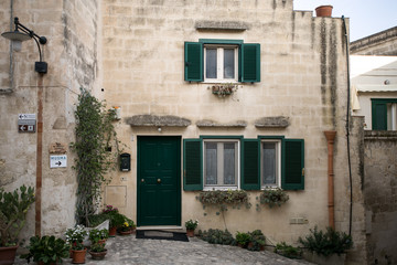 Fototapeta na wymiar Italian medieval yard of the european city with beautiful exterior house and square