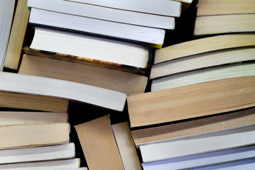 piles of messy books seen from above.