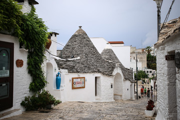 The beautiful white yards with a special houses of Alberobello in the southern part of Italy near Bari