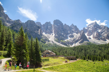 Fototapeta na wymiar trekking in Val Venegia. In the background great view of the Pale di San Martino Dolomites Italy