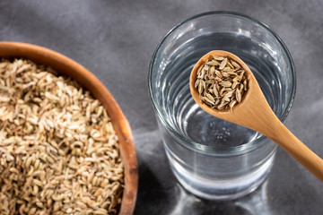 Spoon with fennel seeds to mix with water - Foeniculum vulgare