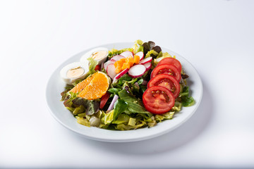 close-up of a mixed salad with pepper cheese, lettuce, radishes and bean sprouts
