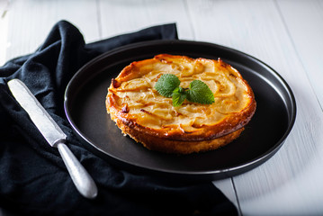 freshly made homemade apple pie on a black background