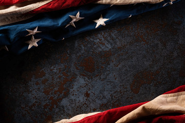 Happy Memorial Day. American flags with the text REMEMBER & HONOR against a black stone texture...