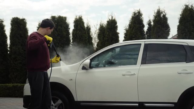 Washing car, car washing process with karcher and soap.