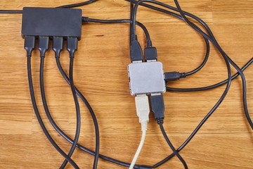 USB hubs connected to each other with many cables and devices