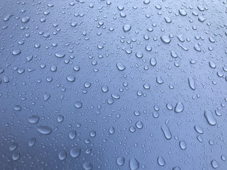 Blue water drops on metall background