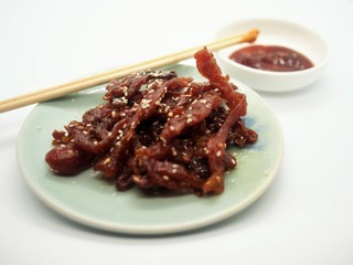 sliced sheets of dried and crispy pork