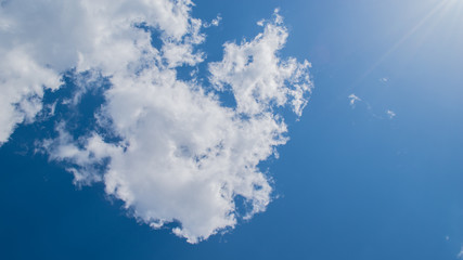 Puffy white clouds and clear deep blue sky in summer with copy space background 