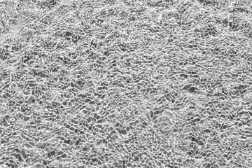 Waves Pattern in crystal clear water on black and white