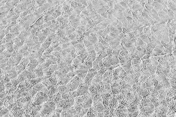 Waves Pattern in crystal clear water on black and white