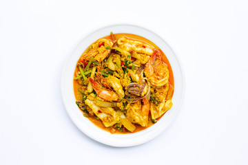 Fried seafood with curry powder on white