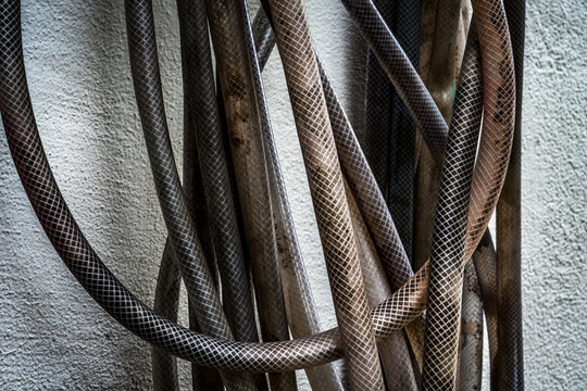 Close Up Of Garden Hose On Wall