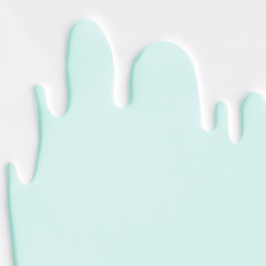 Liquid flowing down concept on pastel background