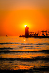 South Haven's lighthouse and pier on Lake Michigan at sunset