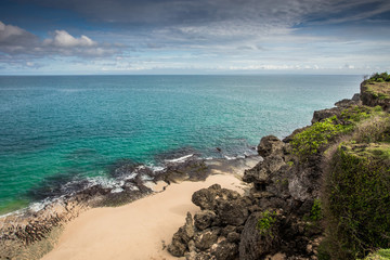 Beach, rock, and sea in Bali