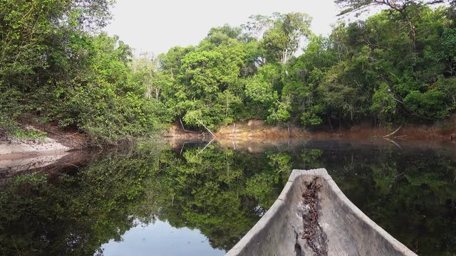 Sailing on Indigenous canoe in Corocoro river. Amazon state Venezuela