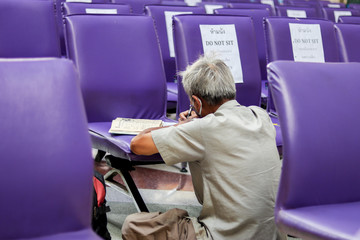 Bangkok, Thailand - Asian people waiting the train keep distance protect from COVID-19