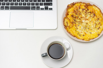 Chinese breakfast placed in front of computer desktop