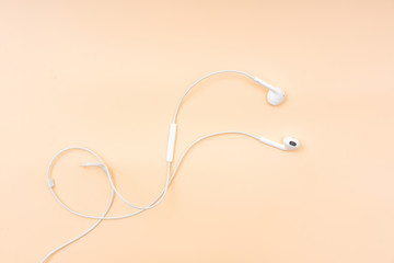 A pair of wired headphones on the desktop