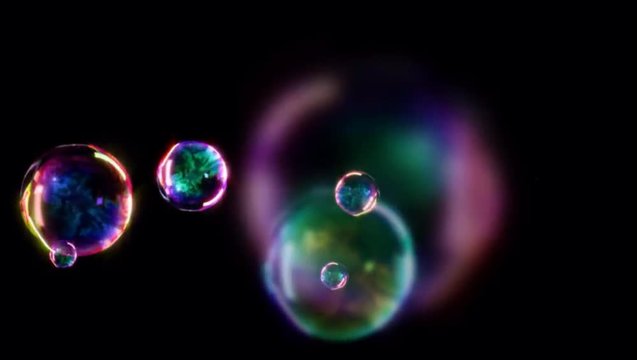 Animation colorful Water bubbles on black background.	