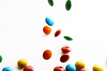 Colorful milk chocolate on white background