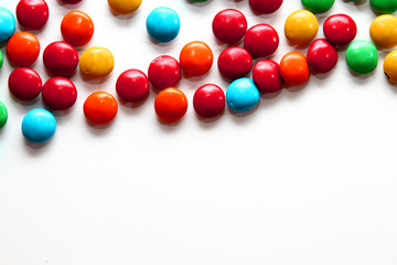 Colorful milk chocolate on white background
