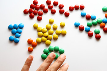 Colorful milk chocolate on white background