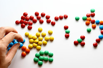 Colorful milk chocolate on white background