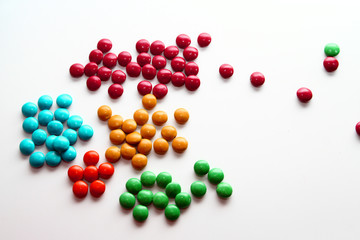 Colorful milk chocolate on white background