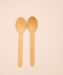 Wooden eating utensils isolated against white background