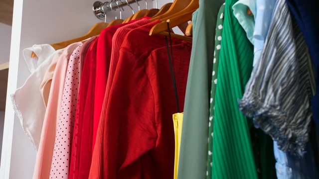 Woman Choosing Clothes From Wardrobe At Home, Closeup