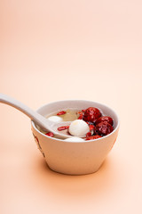 A bowl of dessert syrup on the table