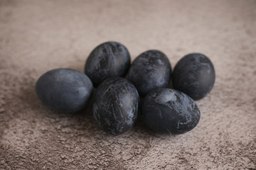 Dark easter eggs on gray background