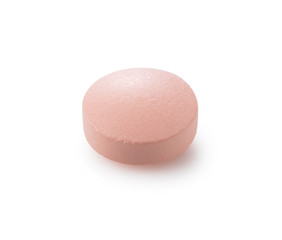 Fototapeta na wymiar Pink pills placed on a white background