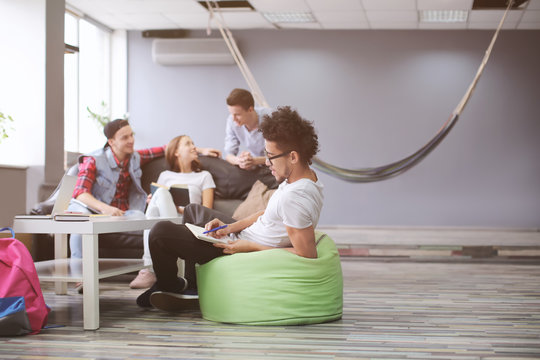 Students resting together in campus building